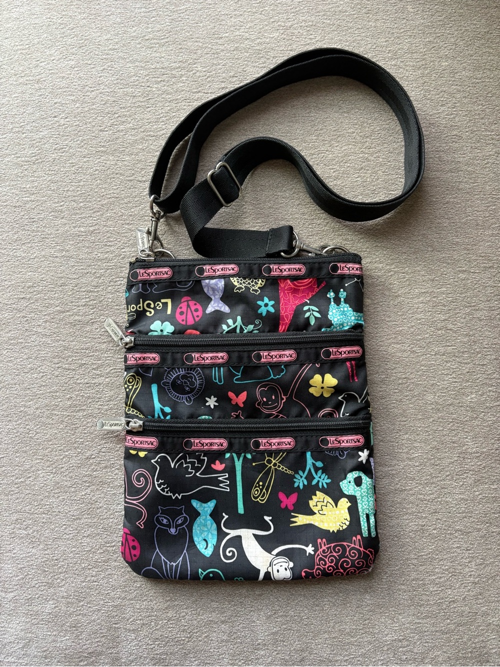 LeSportsac Black Crossbody with Colorful Animal & Floral Print